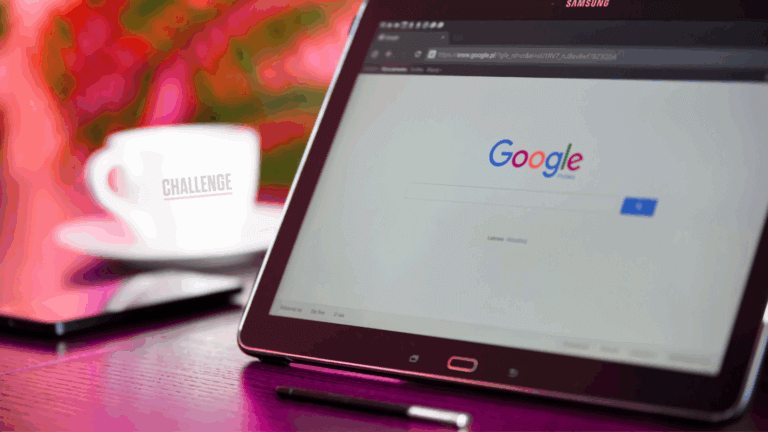 Tablet showing a Google search page beside a Challenge coffee cup