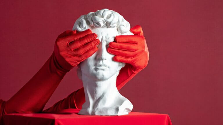 Statue with hands over eyes