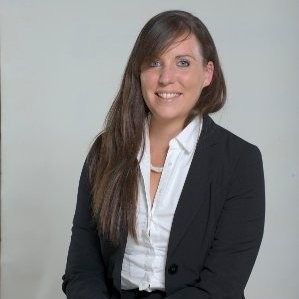 Smiling woman in professional attire.